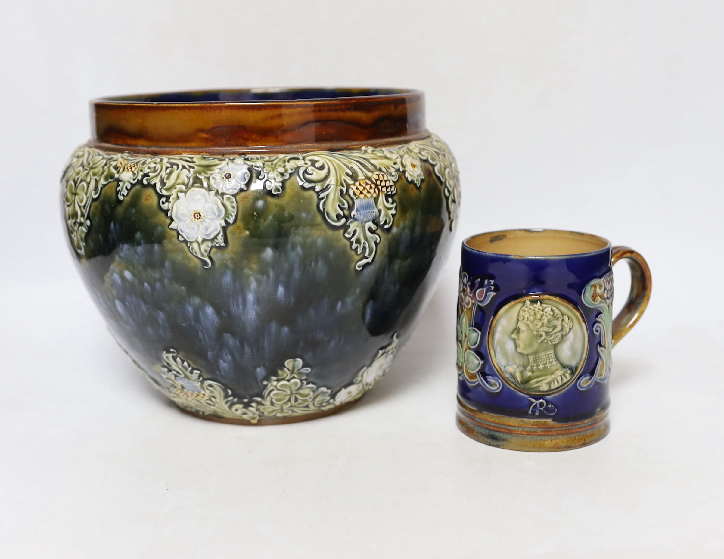 A Royal Doulton Lambeth Edward VII coronation mug and a Royal Doulton jardiniere, 18cm (2)